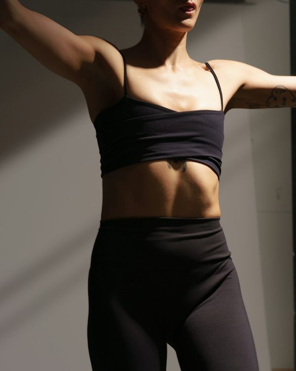 Esempio pole wear worn in the studio: a magenta set with strap detail