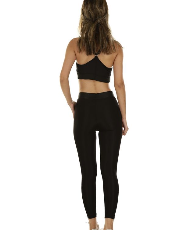 Esempio pole wear worn in the studio: a dark set with fitting straps, seen from the side